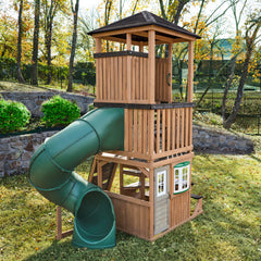 KidKraft Panorama Tower Outdoor Playhouse with a green Long tube slide in a backyard 