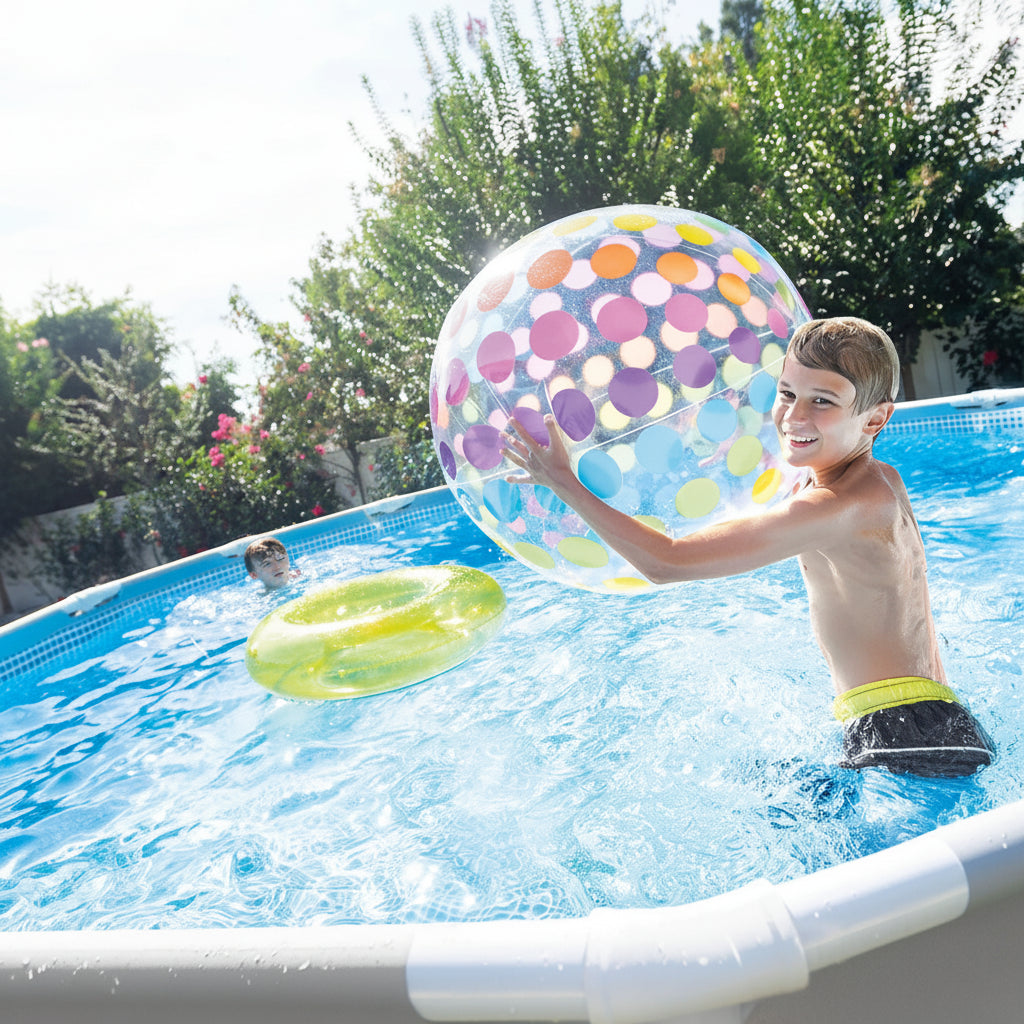 Child playing with a polka dot inflatable ball in a swimming pool