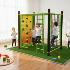 Children playing on an indoor play with a green climbing wall
