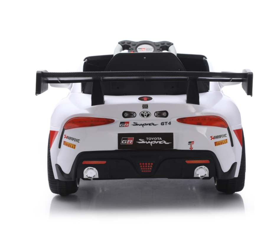 Back view of a white Toyota Supra GT4 ride-on toy car 