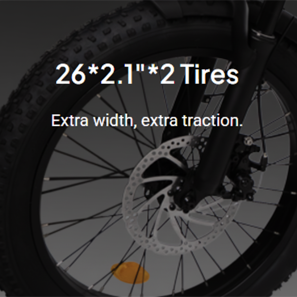 Bicycle tire with text '26*2.1*2 Tires' and 'Extra width, extra traction.'