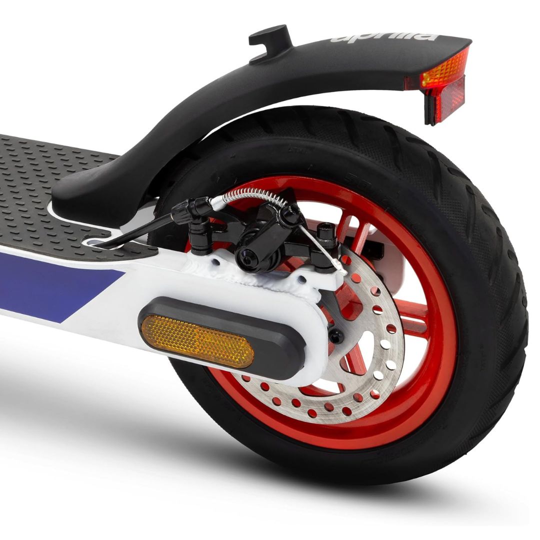 Close-up of a scooter's rear wheel and suspension 