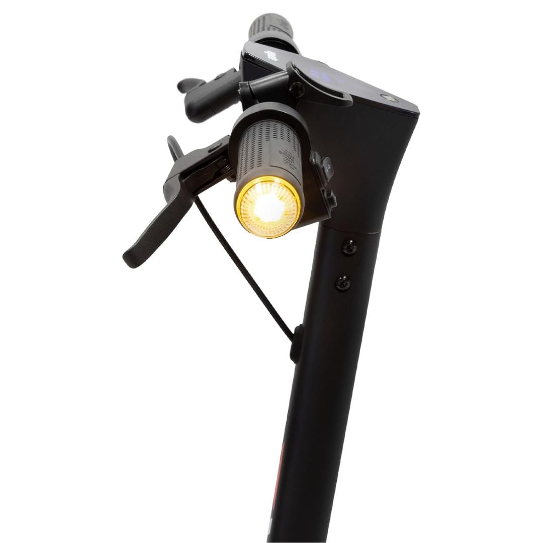 Bicycle headlight attached to a black bike frame