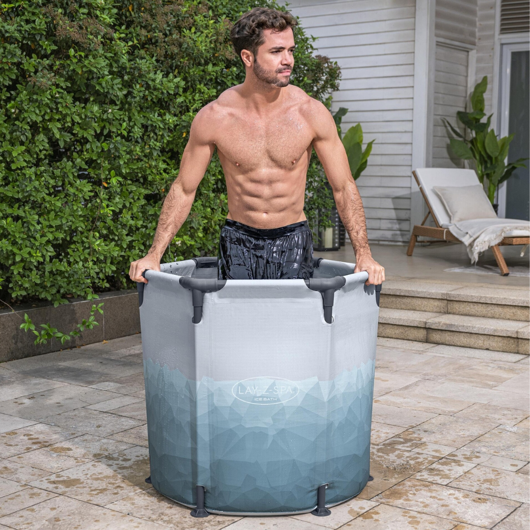A man is lifting a portable inflatable pool