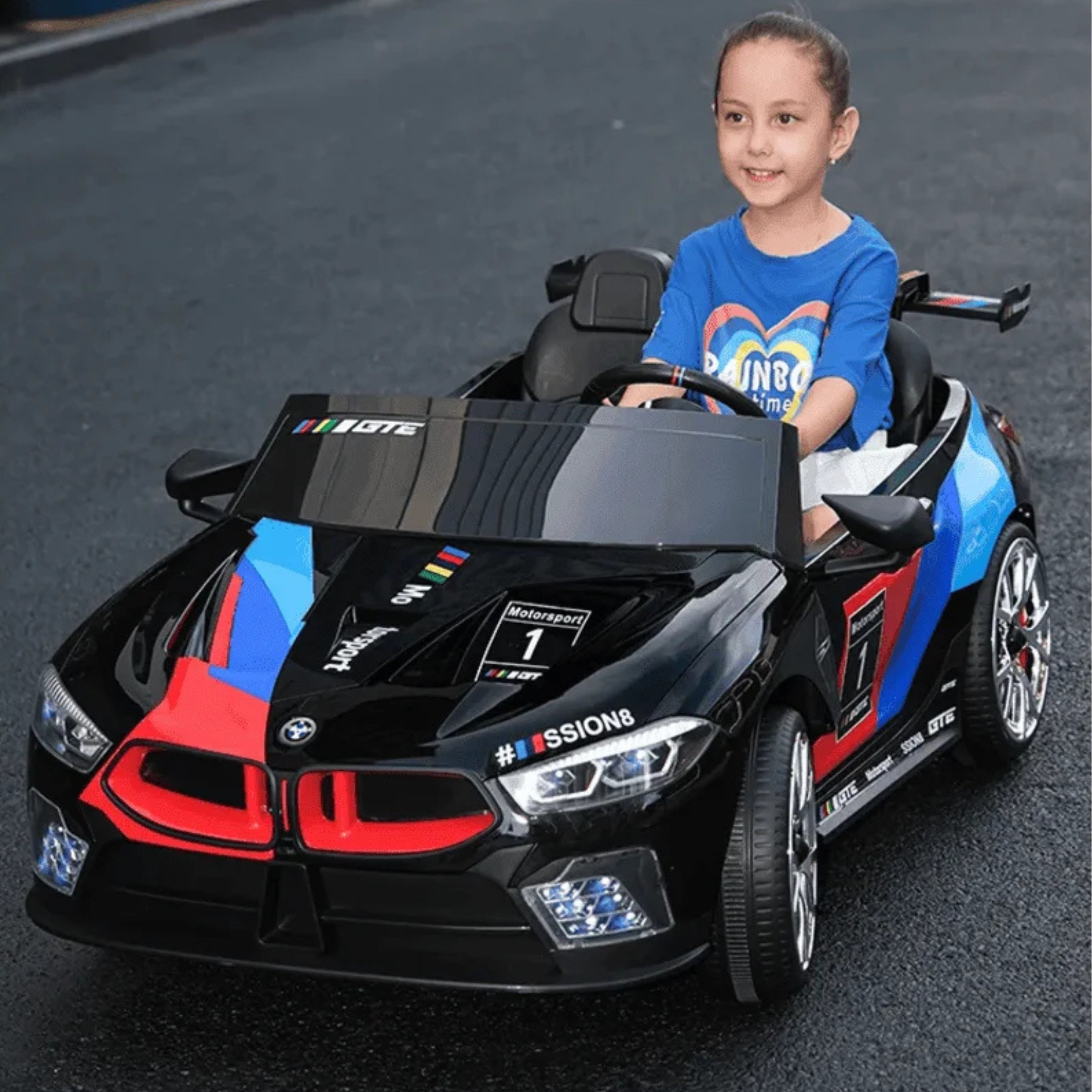 Child sitting in a toy car on a road