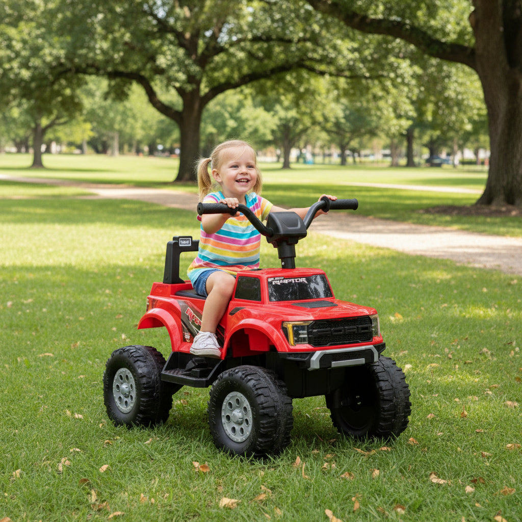 Kids riding on a red toy car with black wheels 