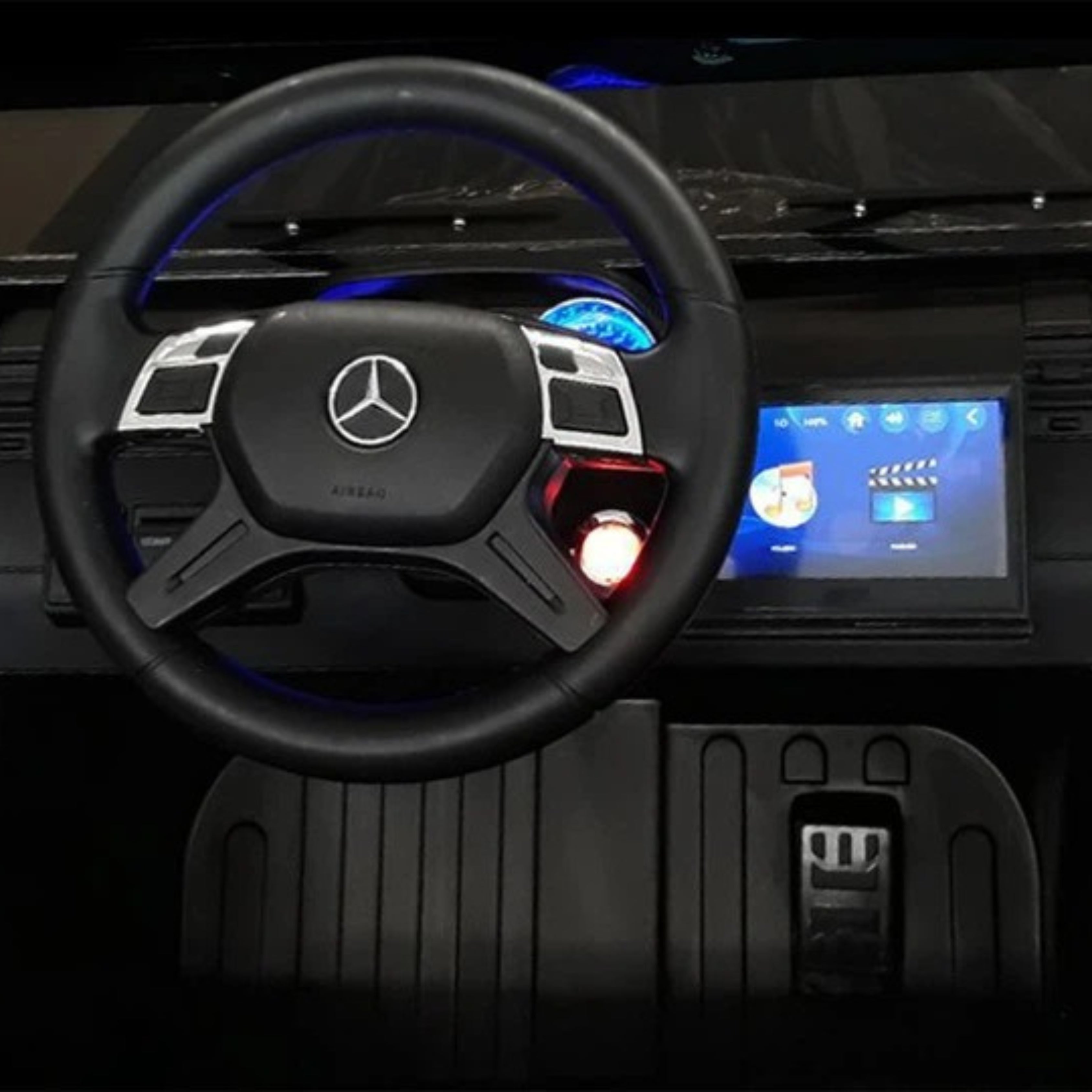 Mini Jeep interior with steering wheel and dashboard, featuring a Mercedes-Benz 