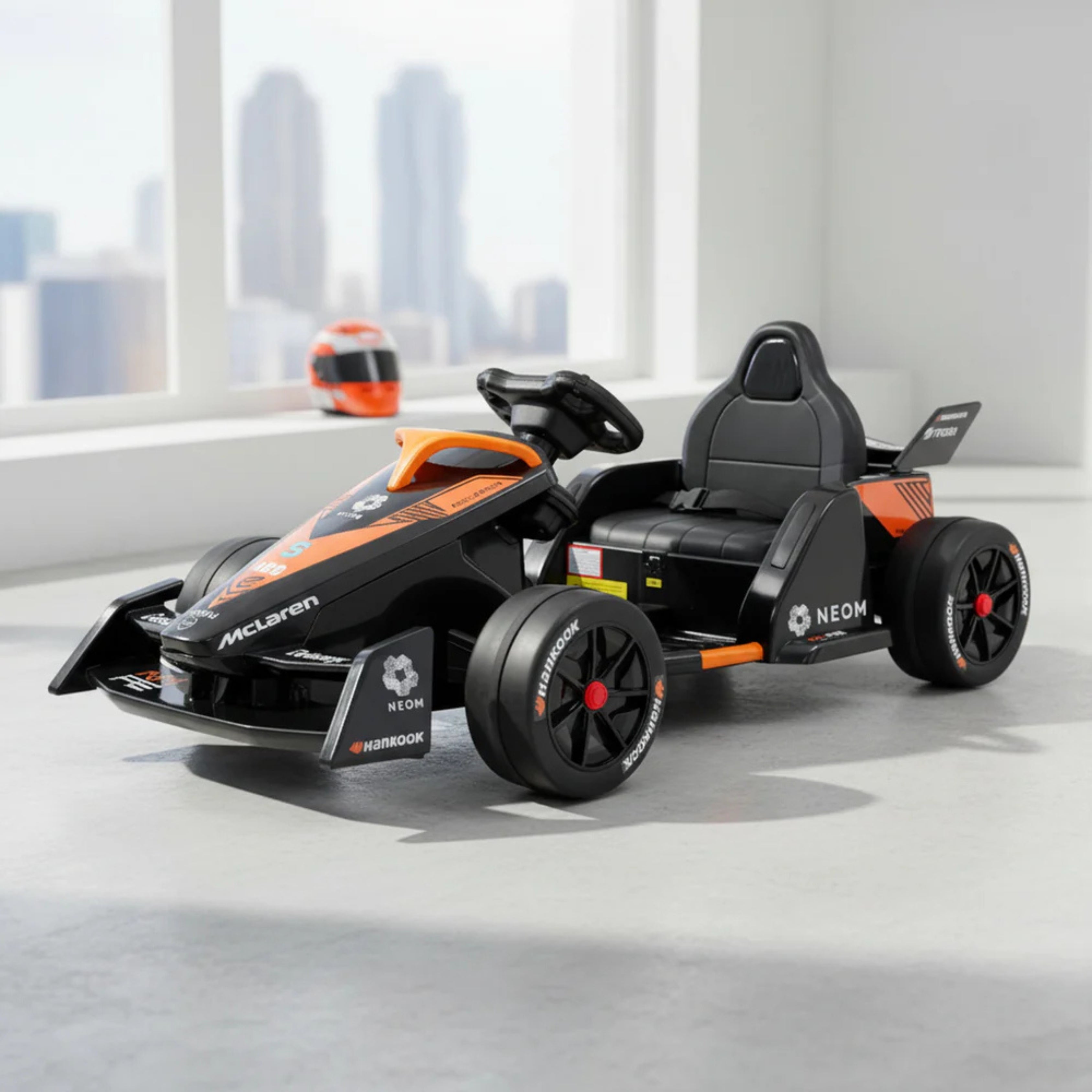 Black and orange toy race car with McLaren
