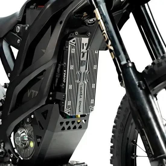 Close-up of an electric motorcycle's engine and suspension system