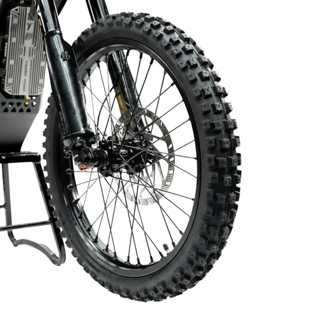 Close-up of a motorcycle wheel with knobby tire 