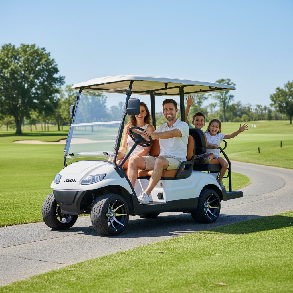 Family of four riding in a white Keon Premium Electric Golf Cart