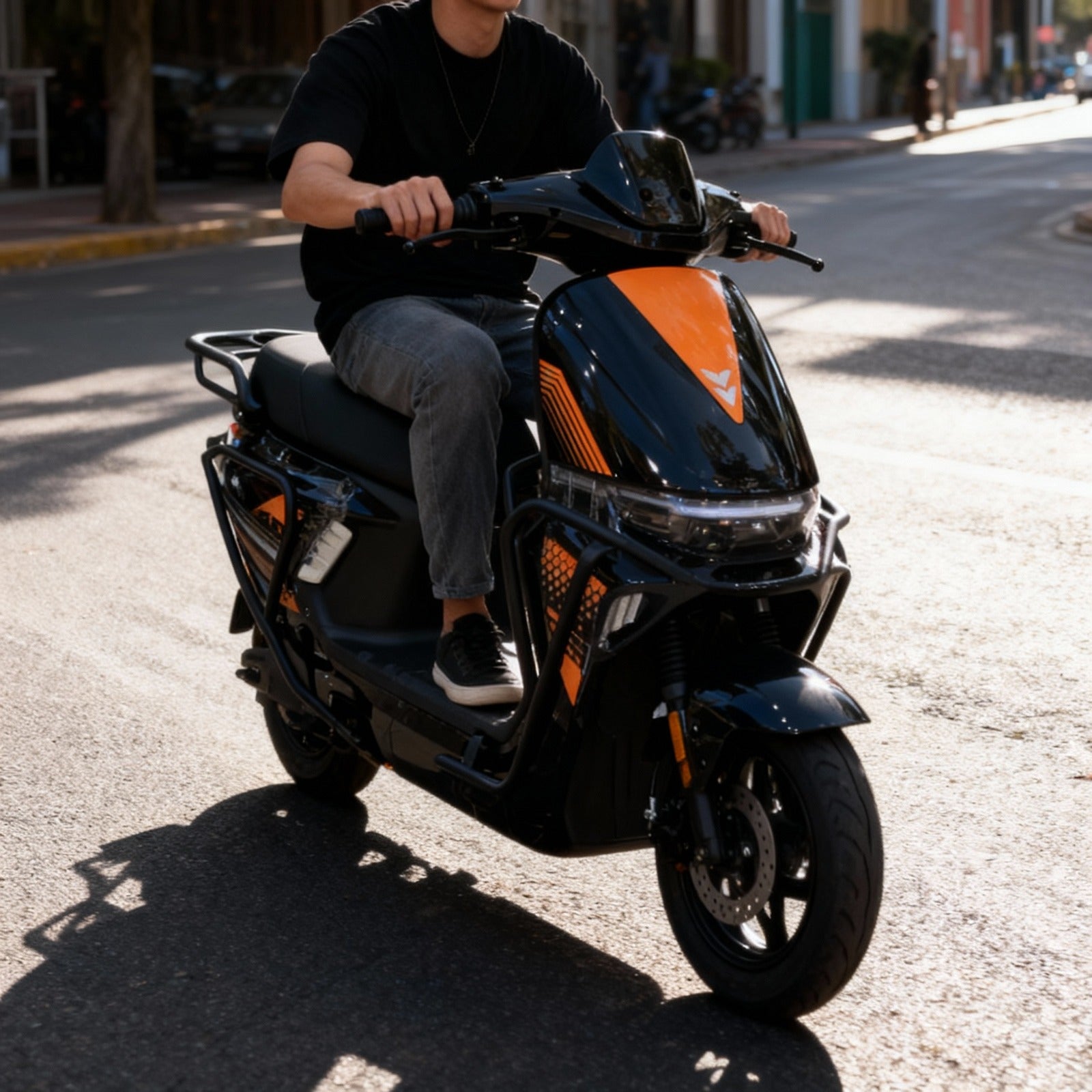Person riding a black Nitro Moped Electric scooter