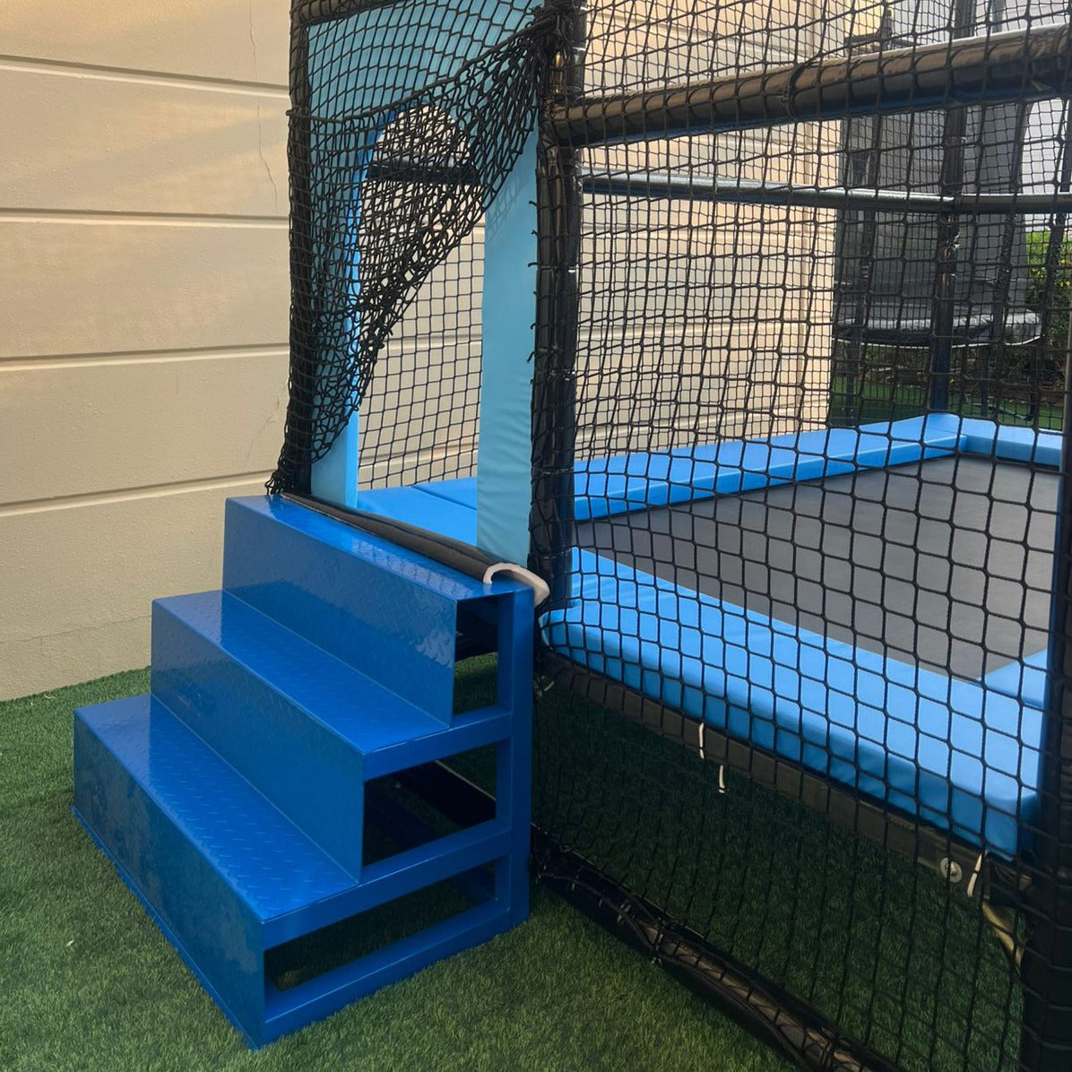 Blue steps leading to Trampoline Rectangular Upper Bounce