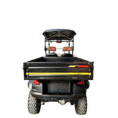 Golf cart with a bed and red and yellow stripes