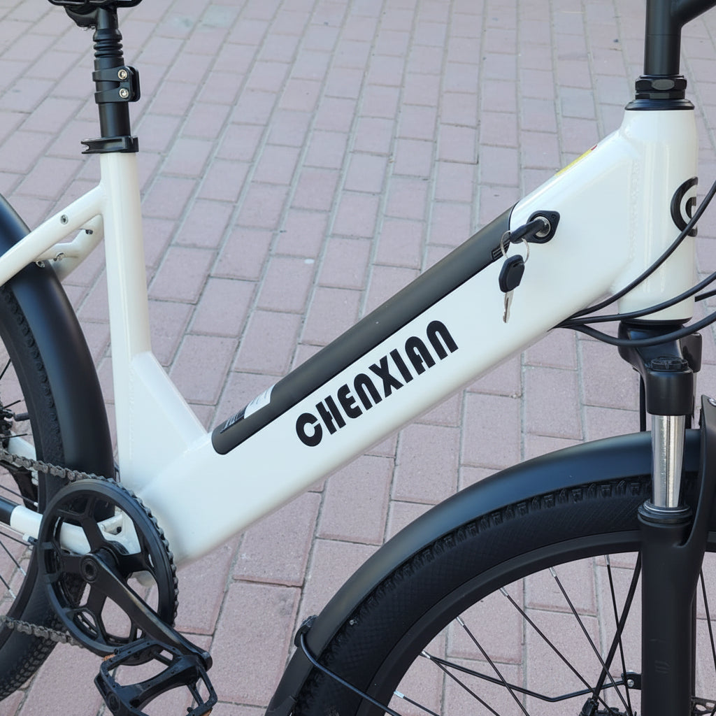 Close-up of a white bicycle with 'Chenxian' branding on a paved surface.