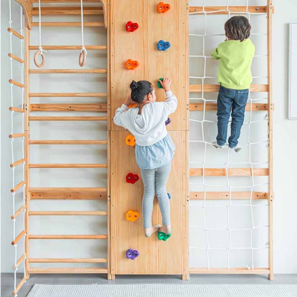 Two children are climbing on a wooden Swedish Ladder Wall Gym Set