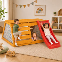 Children playing on a wooden playhouse with a red slide
