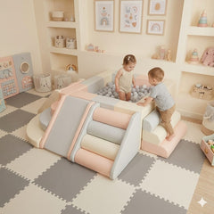 A Soft play Custom ball pit with two toddlers playing, a soft foam slide, and a climbing ramp. 