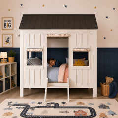 Kids' wooden playhouse bed with small ladder, shown in a styled nursery