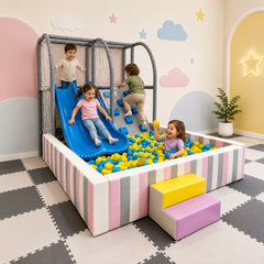 Kids colorful soft play indoor commercial playground with a striped ball pit, blue slide, climbing frame, and small step stools