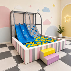 soft play Indoor playground ball pit playset with two blue slides and a gray climbing wall