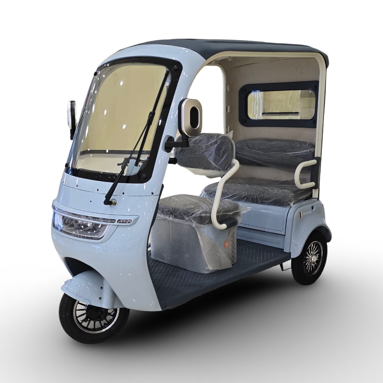 Blue three-wheeled vehicle with seat