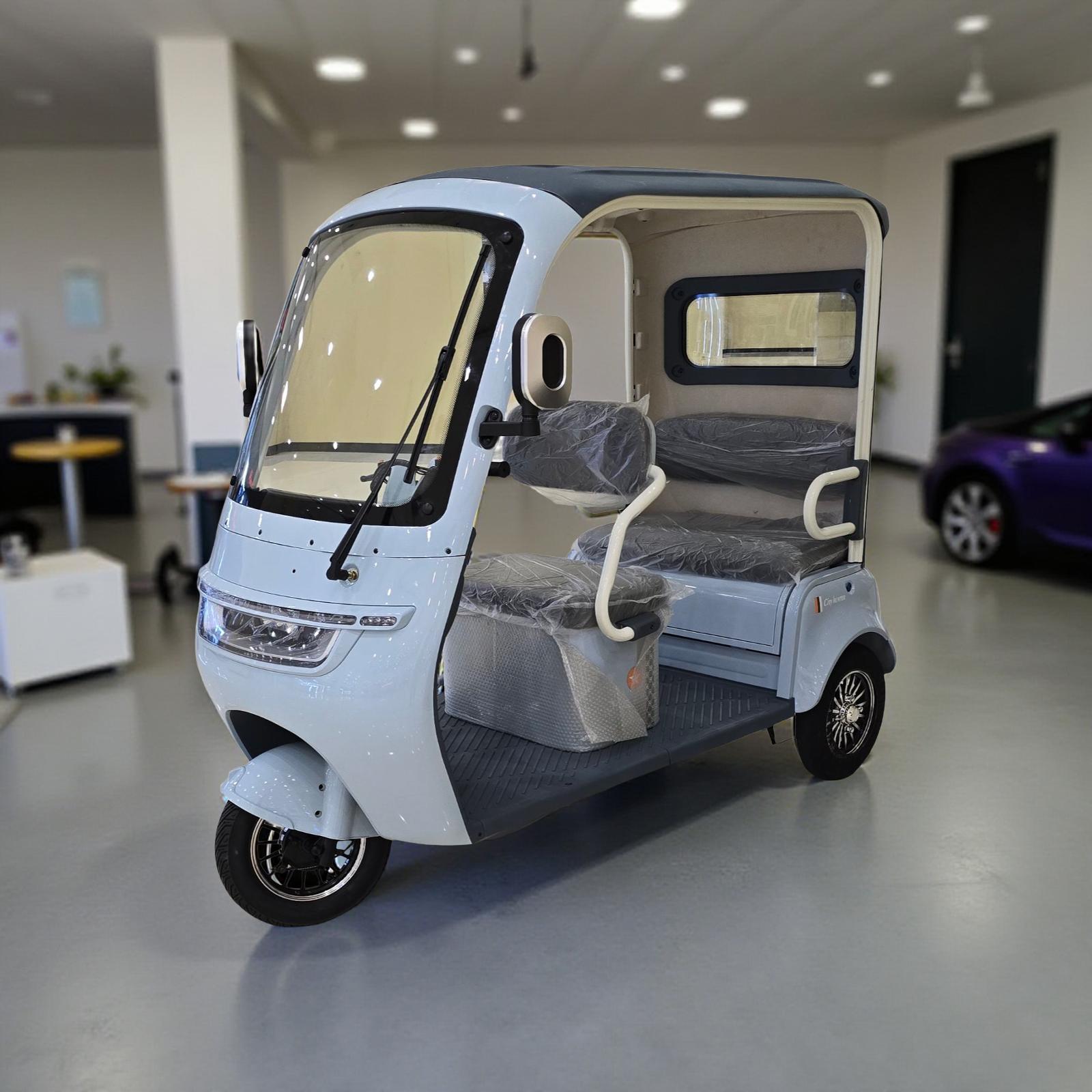 Three-wheeled electric vehicle in a showroom