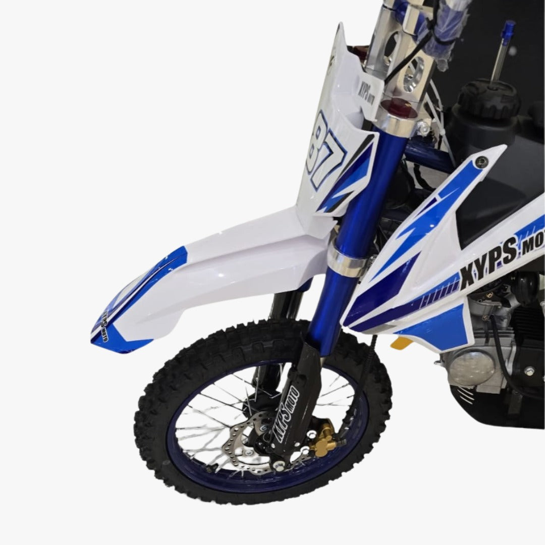 Close-up of a dirt bike with a 125 CC Phantom Dirt Cross Bike