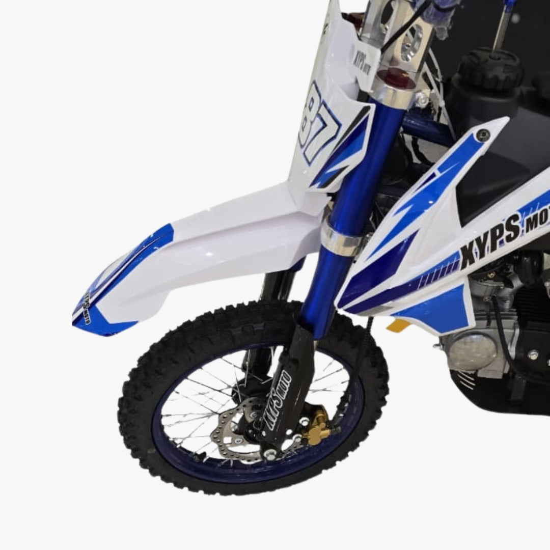 Close-up of a dirt bike with blue and white design