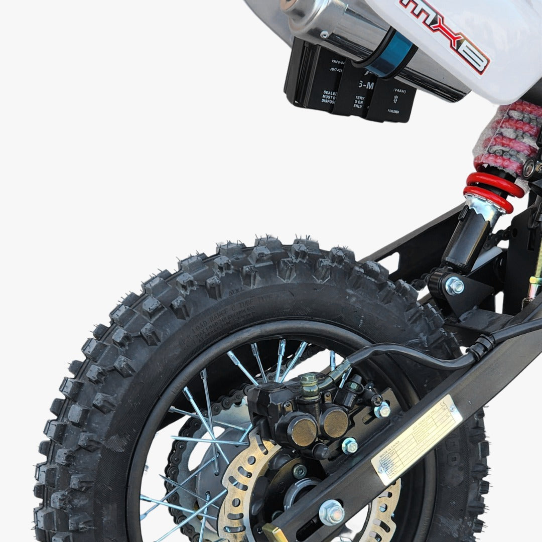 Close-up of a dirt bike wheel and suspension system