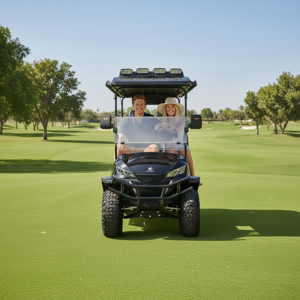 Two people riding in a golf cart on a golf course