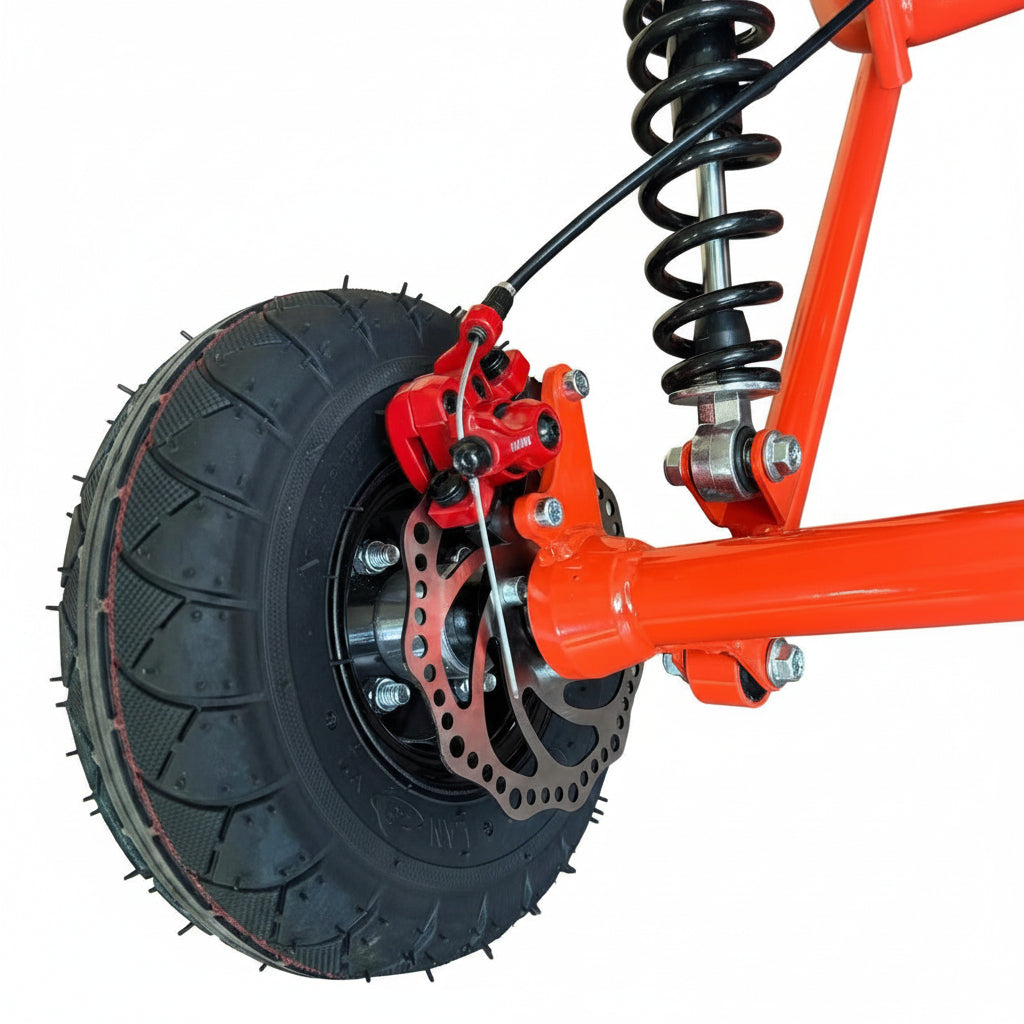 Close-up of a red go Kart wheel with suspension and tire
