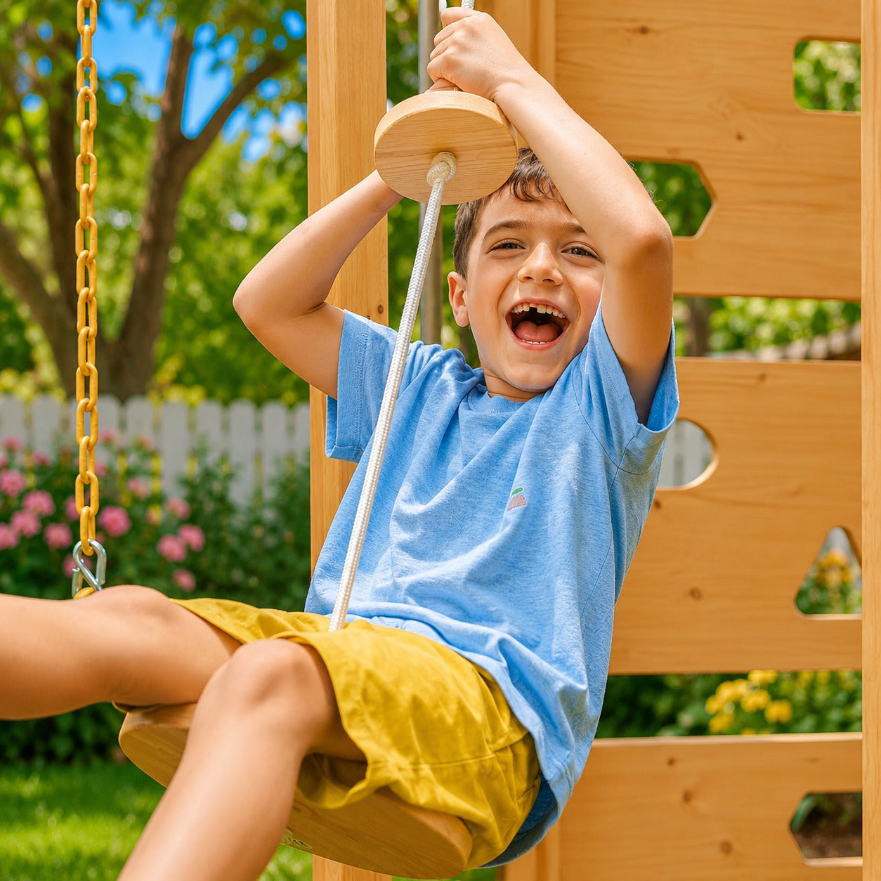 A young boy sitting on a wooden swing 