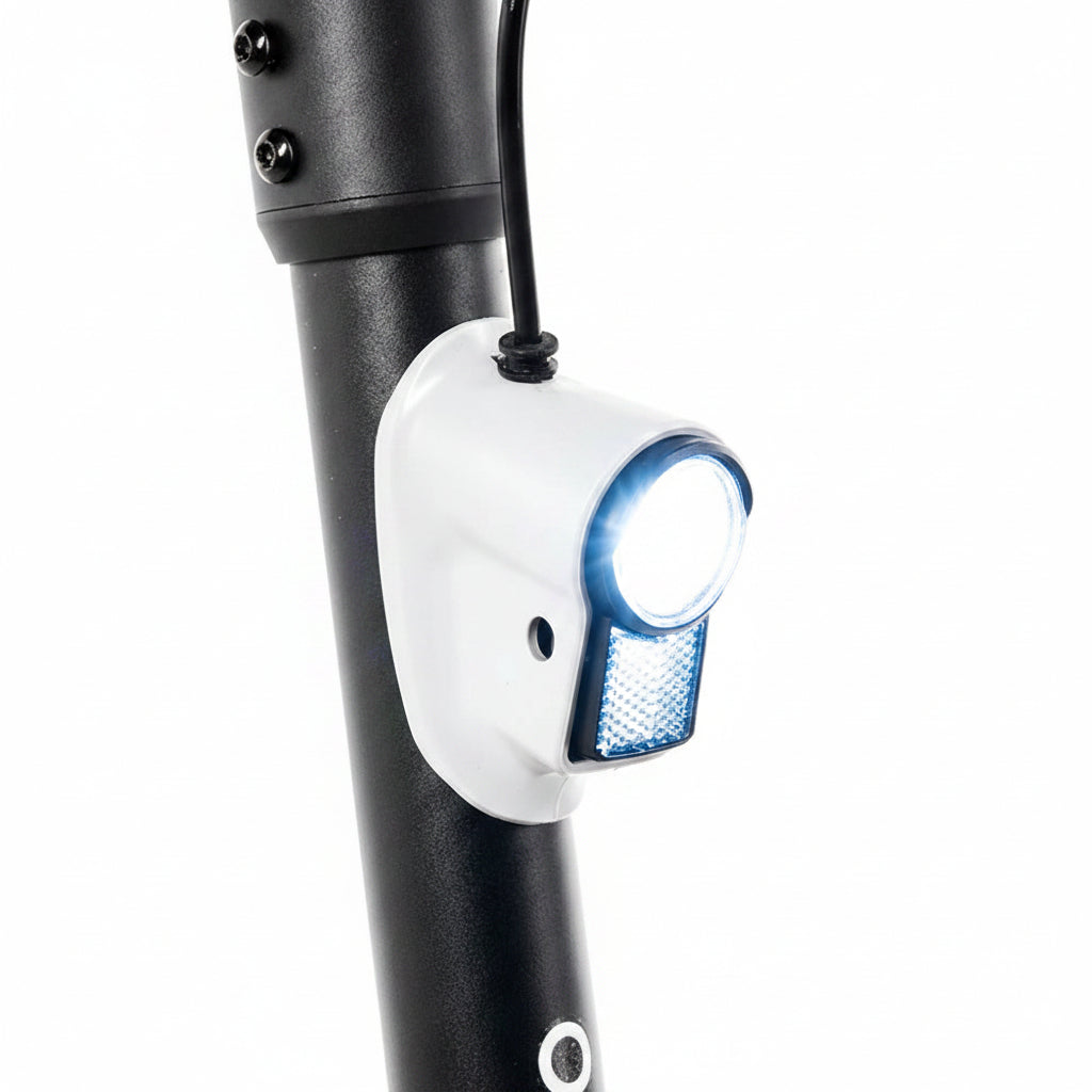 Close-up of a bicycle light attached to a black frame