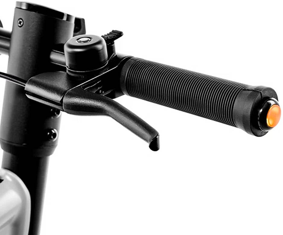 Close-up of a bicycle handlebar with black grips and orange reflectors