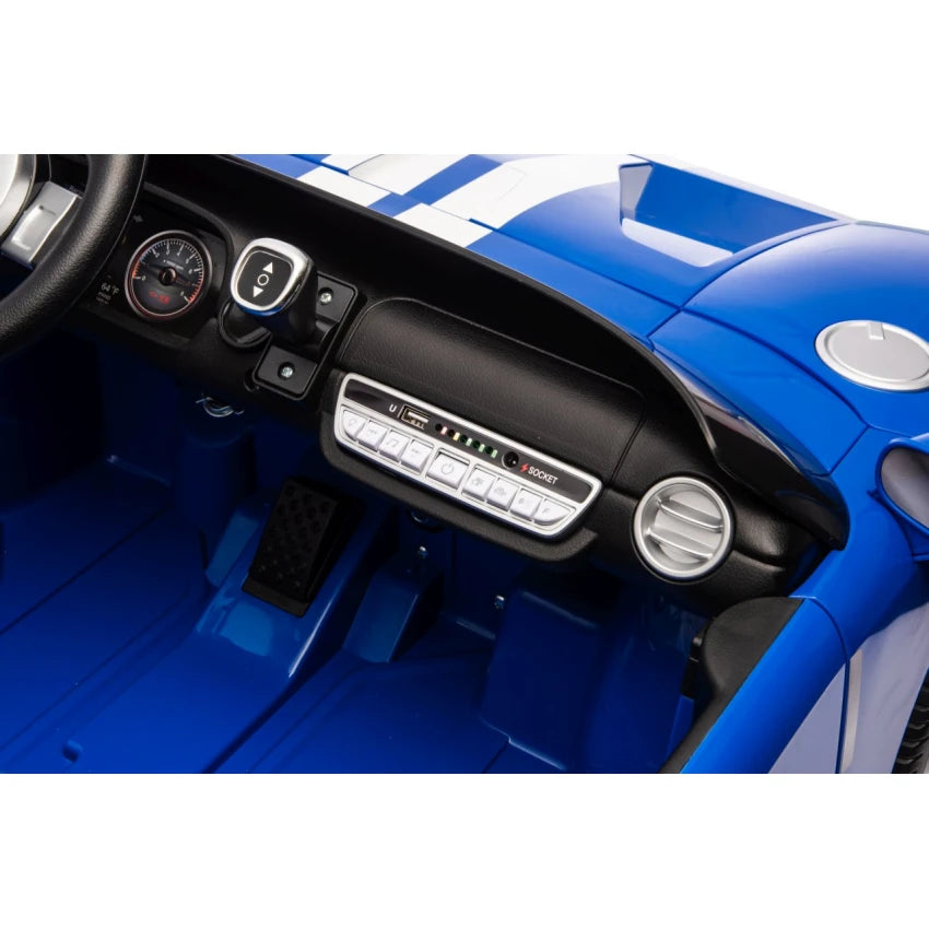 Close-up of a toy car's interior with dashboard and steering wheel