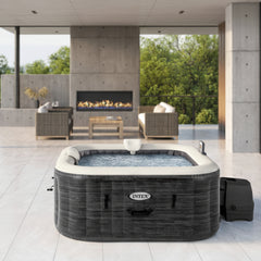 Intex inflatable hot tub on a patio with a fireplace