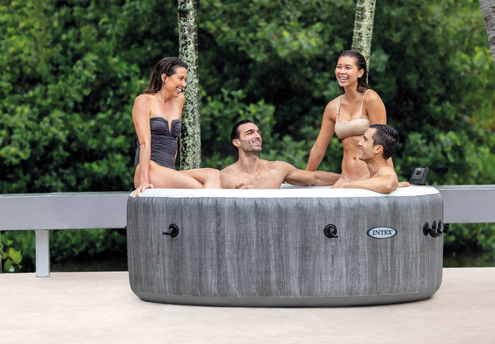 People relaxing in an inflatable hot tub outdoors 