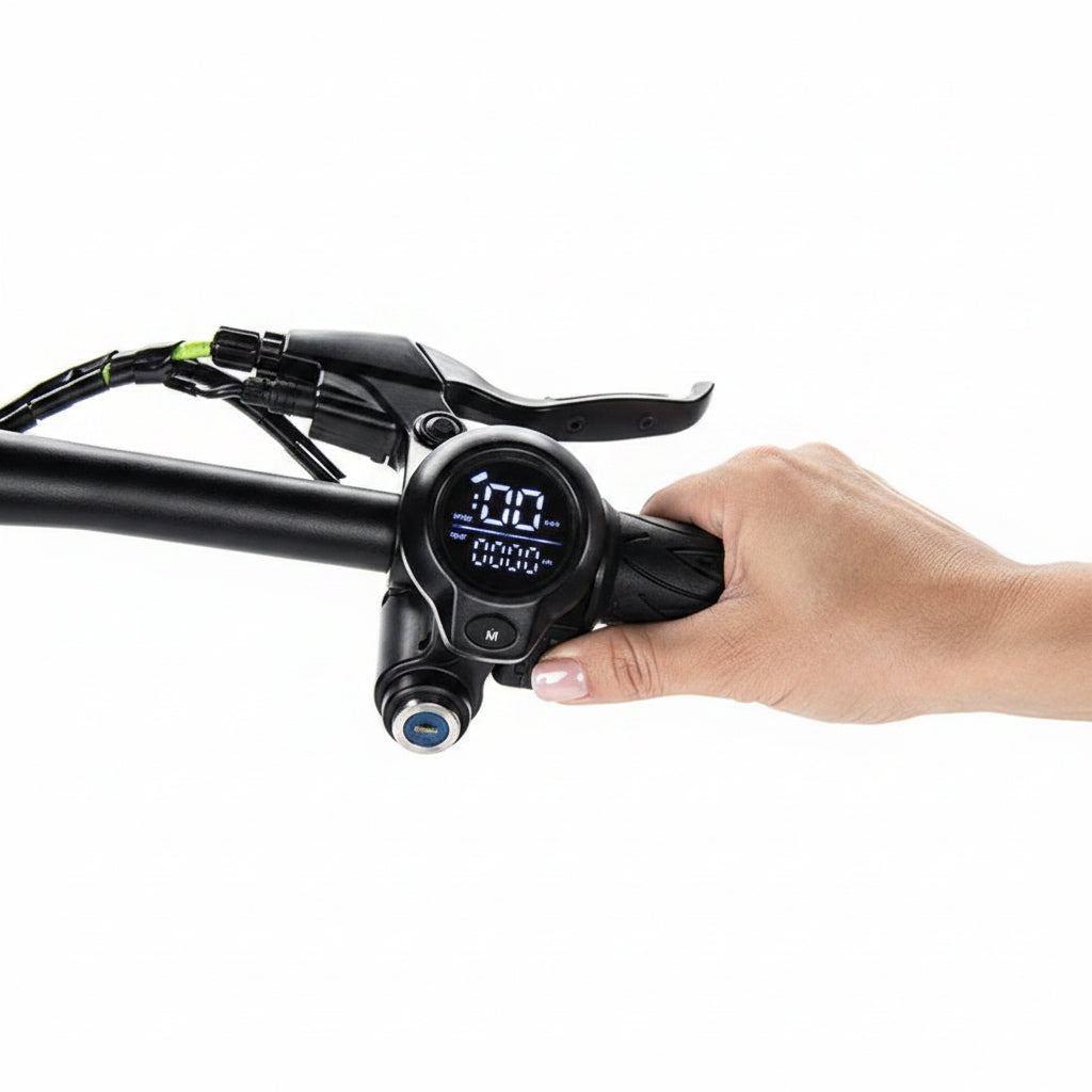 A close-up of a hand adjusting a black handlebar-mounted electronic display on an electric bik