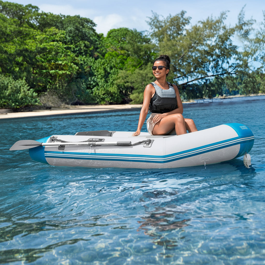 A woman in an inflatable dinghy on blue water 