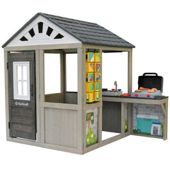 Children's playhouse with kitchenette and toy groceries