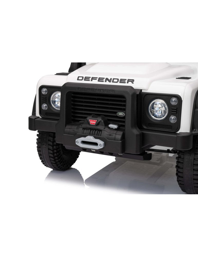 Front view of a white Land Rover Defender