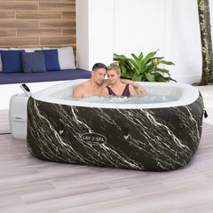 A couple enjoys an inflatable hot tub