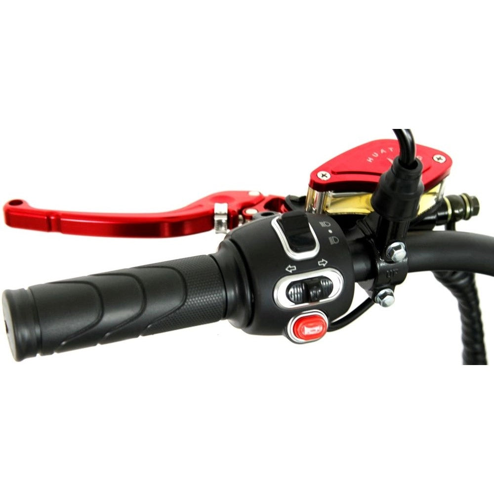 Close-up of a motorcycle handlebar with red brake lever and signal and horn buttons