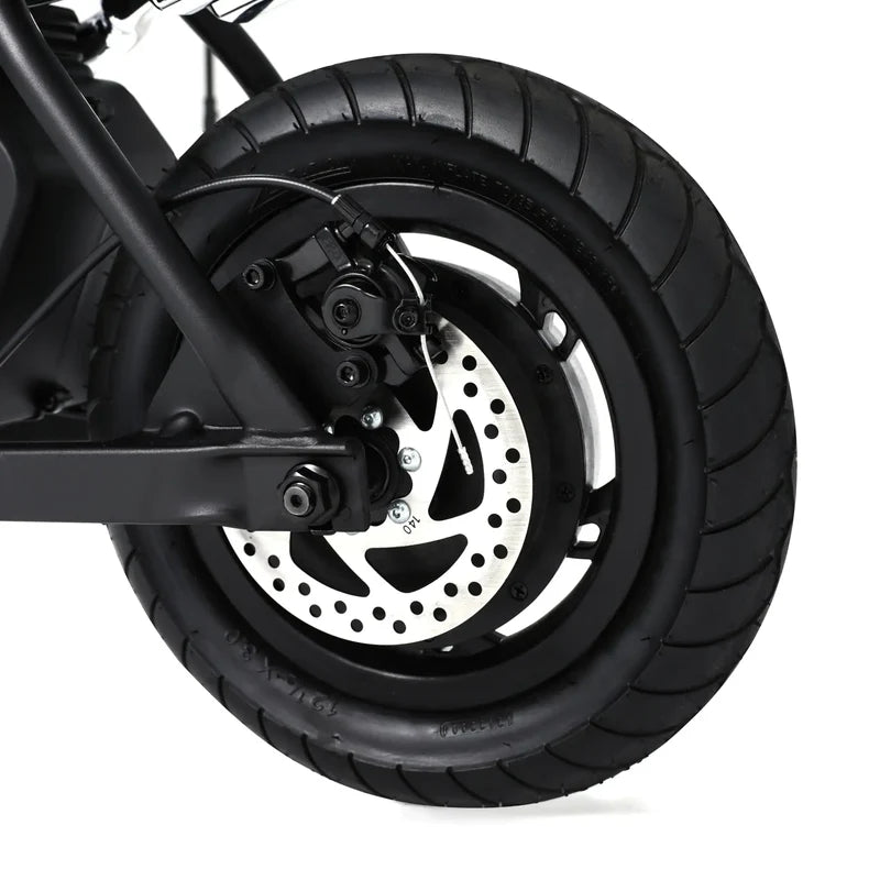 Close-up of a motorcycle wheel with tire and brake disc
