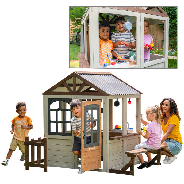 Children playing around a wooden playhouse with a family