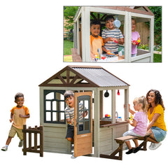 Children playing around a wooden playhouse with a family