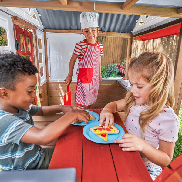 Children playing inside a playhouse