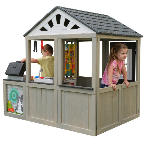 Children playing inside a wooden playhouse with a gray roof