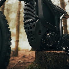 Close-up of across motorcycle with 'KOMADO' branding, Engine 
